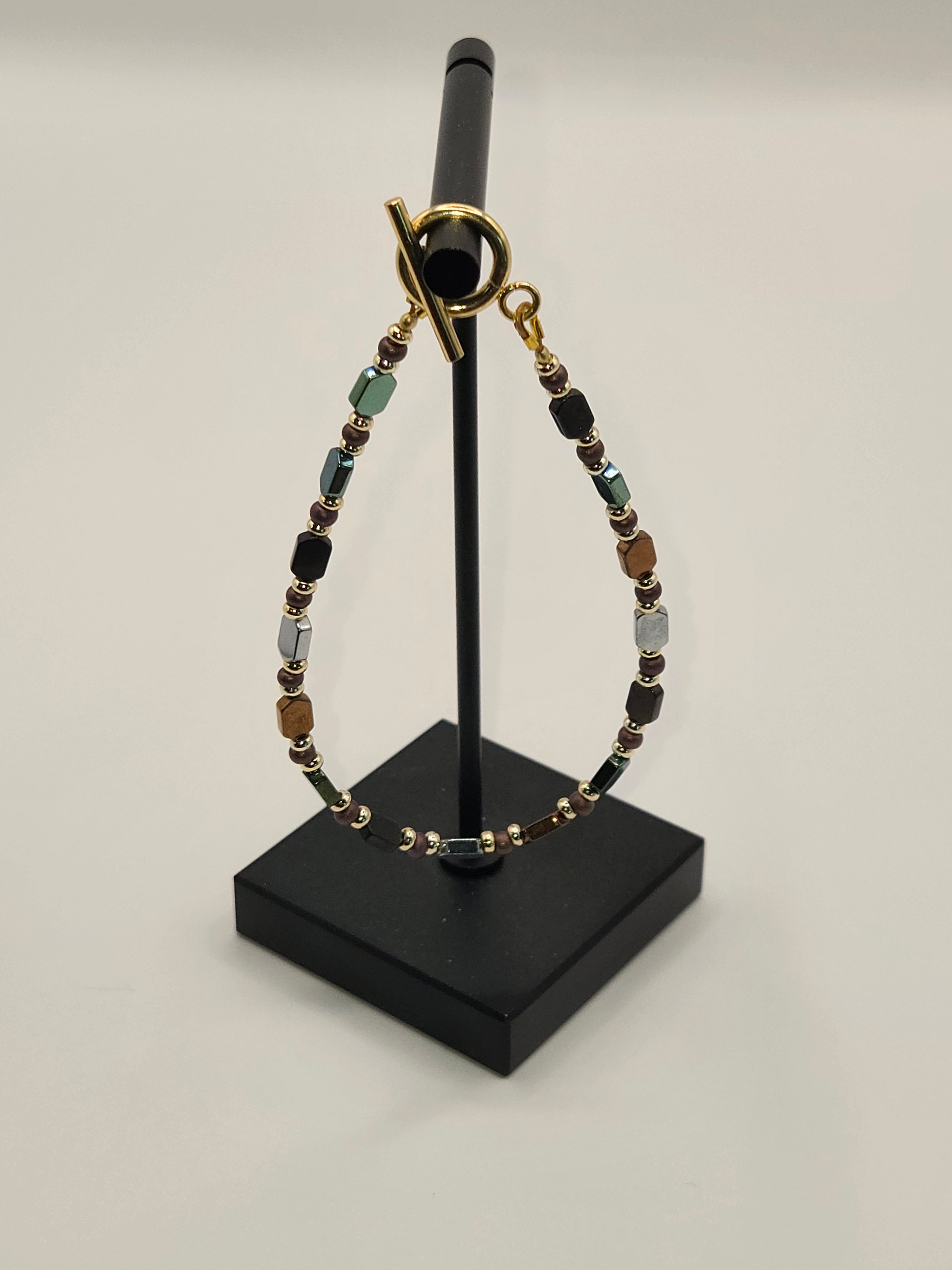 BR-025 Multi Media Hematite · Bronze · Gold Toggle Bracelet